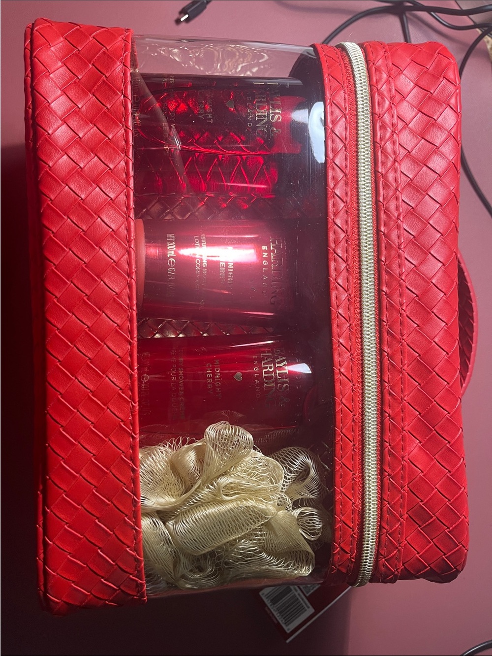 Red Woven Clear-Front Cosmetic Case with Handle and goodies inside